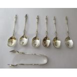 A set of six silver apostle spoons and a set of matching sugar tongs Sheffield 1928 cased U