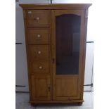 A 20thC rustically constructed pine compactum with a bank of four side drawers,