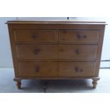 A 20thC pine four drawer dressing chest,