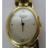 A ladies Longines 18ct gold cased wristwatch, the movement faced by an oval,