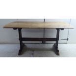 An early/mid 20thC beech and oak table,