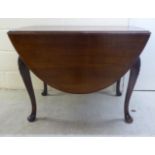 An early 20thC Georgian inspired mahogany drop leaf table,