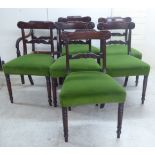 A set of seven William IV mahogany framed dining chairs, the C-scrolled and wave carved bar backs,