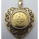 A 9ct gold heart shaped pendant, containing a 1945 dos pesos gold coin,