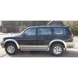 A 2001 Mitsubishi Shogun Sport Equippe V6 petrol manual estate, 2972cc, in black livery, Reg.No.