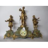 A mid 20thC three piece clock garniture, comprising a maiden and two children, picking flowers,