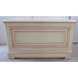 A modern cream painted blanket chest with opposing brass bar handles 22''h 40''w U