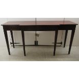 An Edwardian crossbanded ebony inlaid mahogany breakfront serving table with two frieze drawers,