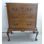 A 1930s burr walnut and mahogany finished three drawer chest on stand,