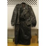 A German military black hide trench coat with a lapel badge/miniature dress medal and ribbon tied