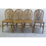 A matched set of four early 20thC and later, light oak and elm framed hoop,