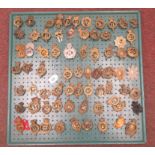 Approx seventy military cap badges and other insignia, some copies: to include The South Gloucester,