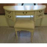 A Laura Ashley Clifton cream painted, demi-lune, five drawer kneehole dressing table,