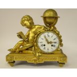 A late 19thC French cast gilt metal cased mantel clock, featuring a child,