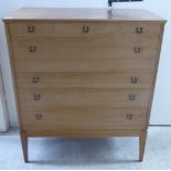 A 1970s/80s mahogany five drawer dressing chest, raised on square,