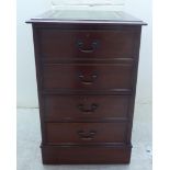 A modern mahogany filing cabinet, the top with a tooled and gilded wide scriber and two drawers,