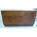 A G-Plan teak sideboard, comprising a single drawer, over three cupboard doors,