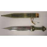 A 20thC Persian dagger with a decorative wire mounted and wound handgrip the blade 12''L in a