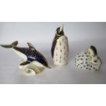 Three Royal Crown Derby china paperweights with gilt stoppers, viz. a penguin 5''h; a dolphin 3.