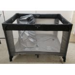 A Mothercare travel cot U