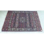 A North African design rug, decorated with repeated, stylised designs,