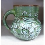 A Branham Barham ware green and brown glazed pottery cream jug,
