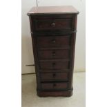 An early to mid 19thC walnut pedestal bedside chest, having four drawers and a fall flap,