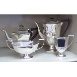 A four piece silver plated tea set of demi-reeded elongated octagonal pedestal form comprising tea