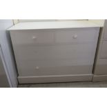 A 20thC white painted pine four drawer dressing chest,