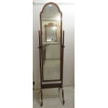 A 1930s Queen Anne inspired walnut finished cheval mirror,