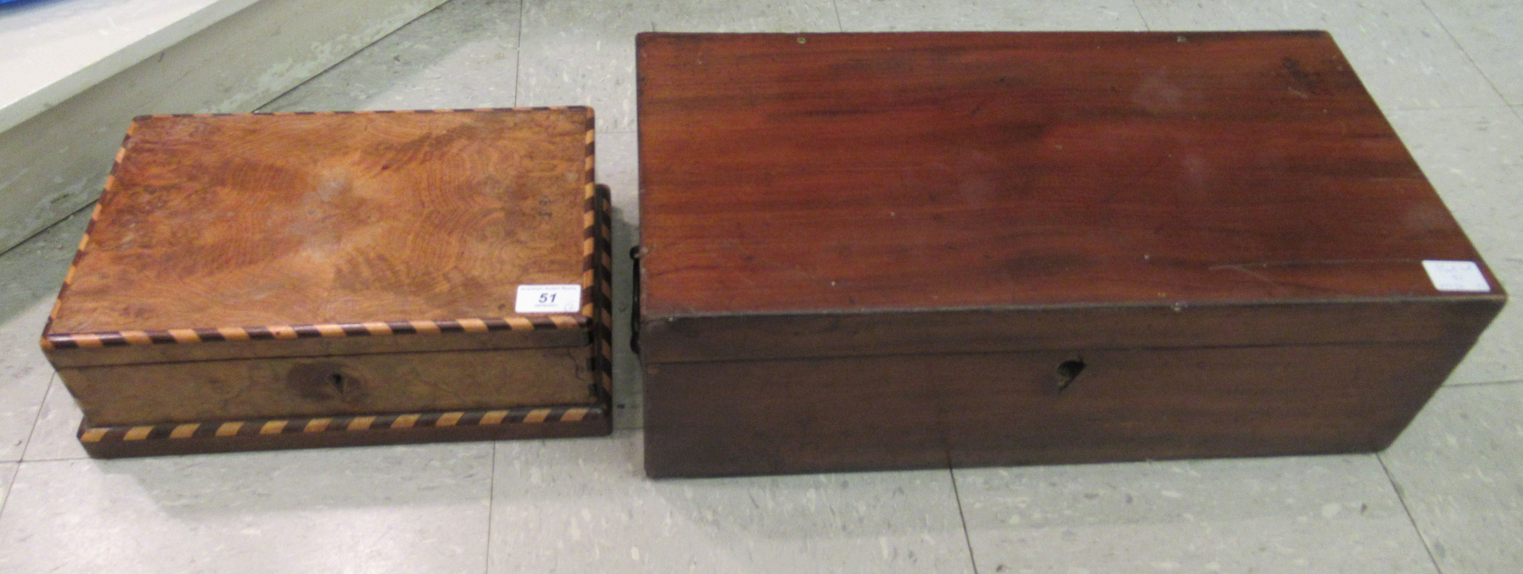 An unfitted late Victorian mahogany writing box with an angled,