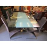 A Rolf Benz extending glass top dining table,