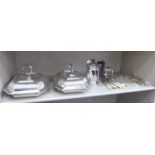 Silver plated tableware: to include a pair of elongated entree dishes with covers;