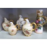 Four Royal Worcester blush ivory glazed china, floral decorated and gilded flatback jugs largest 6.