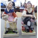 A pair of late Victorian Staffordshire pottery figures,