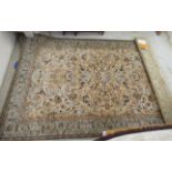 A Polish rug, profusely decorated with flora in pastel tones,