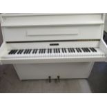 A Kemble matt white cased, iron framed upright piano, no.187017 39.