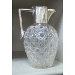 A Victorian style hobnail and silver slice cut glass wine decanter of ovoid form with an applied