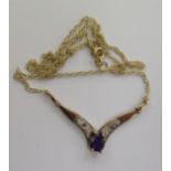 A 9ct gold claw set amethyst and diamond set wishbone pendant,