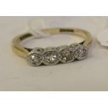 A gold coloured metal claw set four stone diamond ring 11