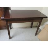 An early/mid 19thC mahogany card table, the foldover top on a rear gateleg action,