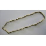 A 9ct gold curved tube and ring link necklace,