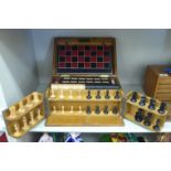 An Edwardian light oak cased tabletop games compendium: including chess, draughts,