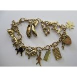 A 9ct gold charm bracelet 11