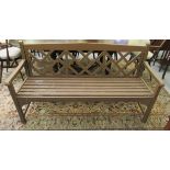 A painted teak garden bench with a level back and open arms,