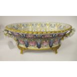 An early 20thC Continental porcelain oval basket, having pierced sides, flared rims and opposing,