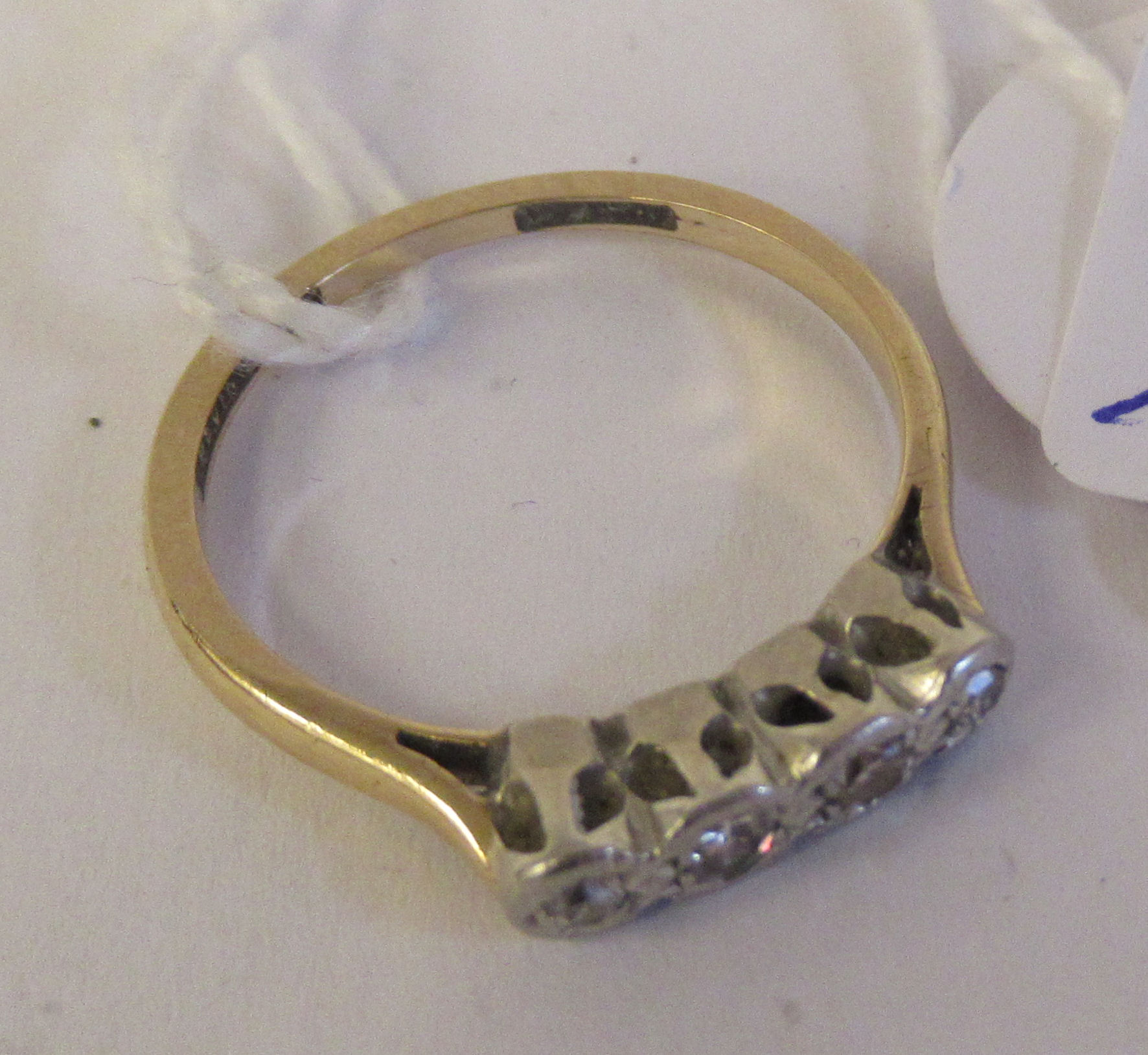 A gold coloured metal claw set four stone diamond ring 11 - Image 2 of 2