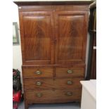 An early/mid 19thC mahogany linen press, having a moulded cornice,