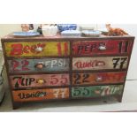 A modern novelty transfer print finished, eight drawer dressing chest,