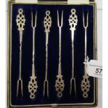 A set of six Edwardian silver cocktail forks with twin tines,